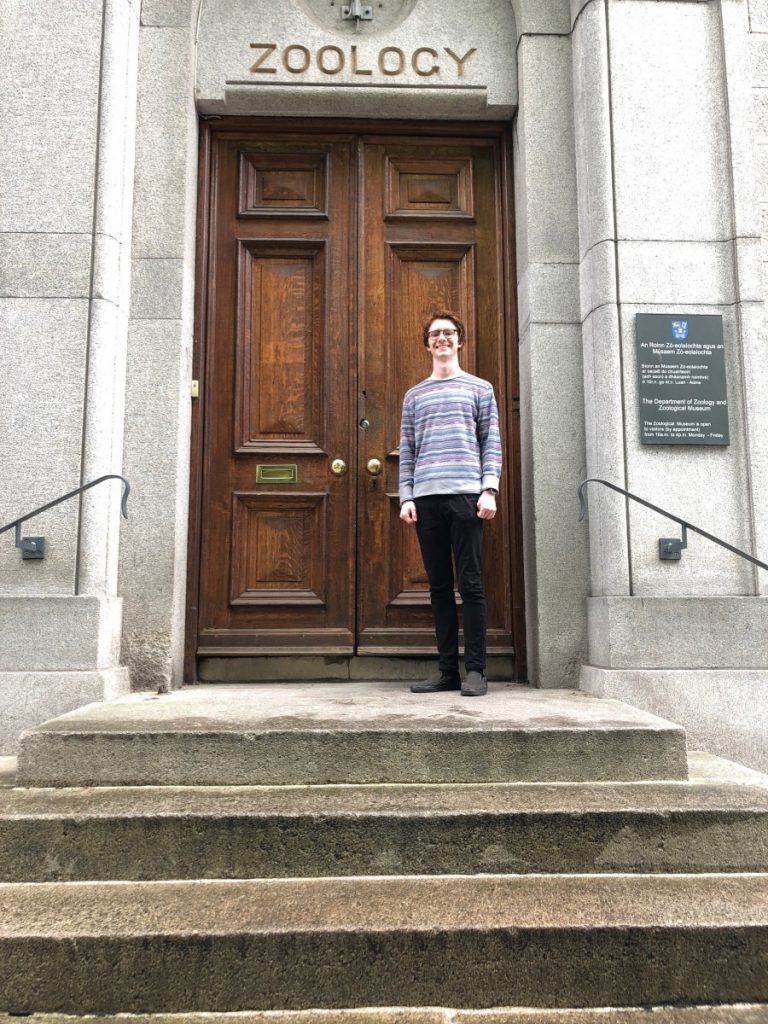 Intern Patrick Friend stands in front of zoology building in Dublin, Ireland
