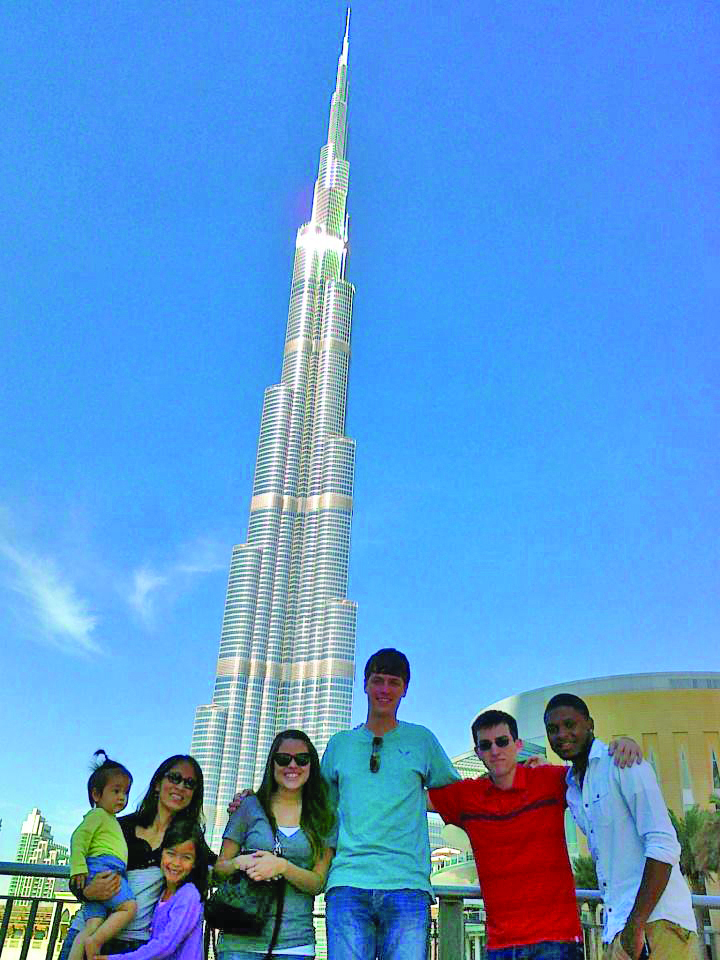 Study abroad students and family stand in front of Burj Khalifa