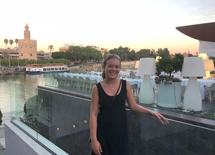 API student Tera Cafro stands in front of Rio Guadalquivir in Seville Spain