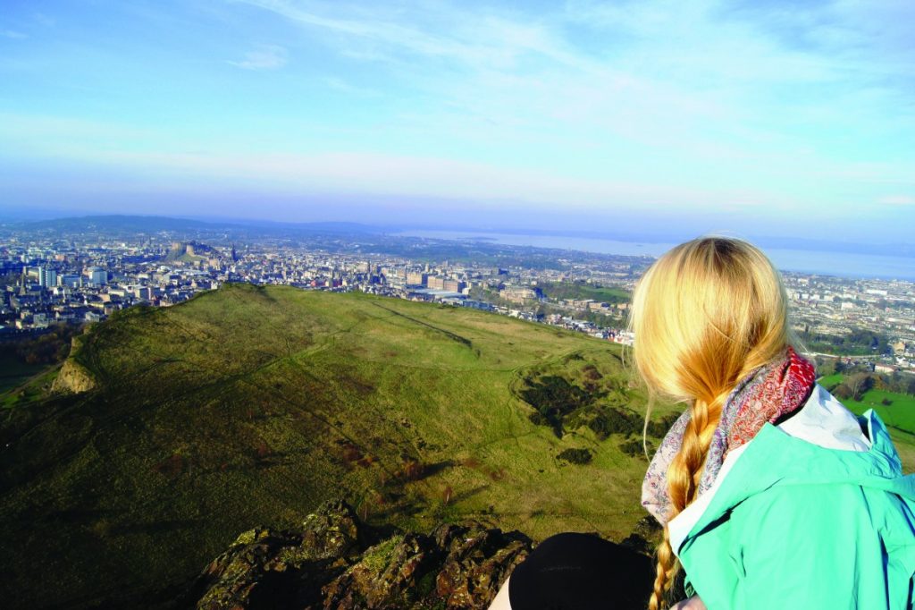 STEM student overlooks Edinburgh Scotland skyline