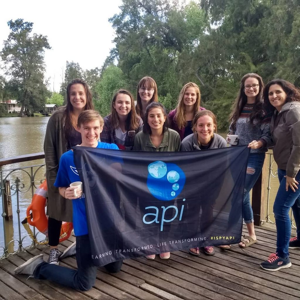 Buenos Aires study abroad students pose with API flag in Tigre Argentina