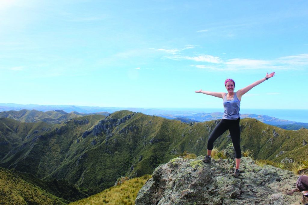 University of Otago student on cliffside of Dunedin, New Zealand