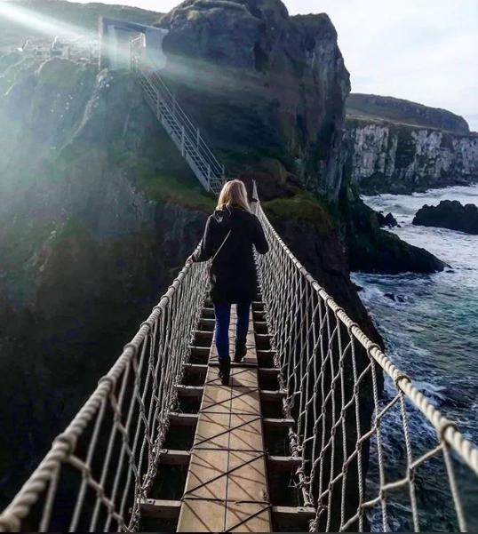 API alumni crossing Carrick-a-rede bridge in Ireland