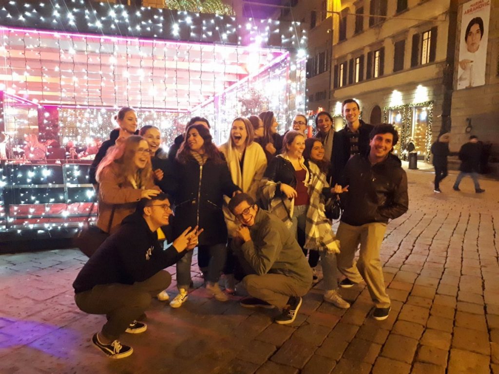 Florence study abroad students outside with Christmas lights