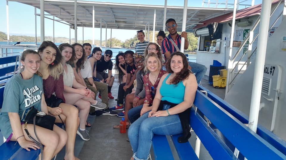 API students smiling on boat in Costa Rica