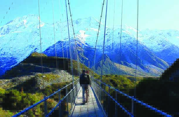 New Zealand student navigating bridge in mountains
