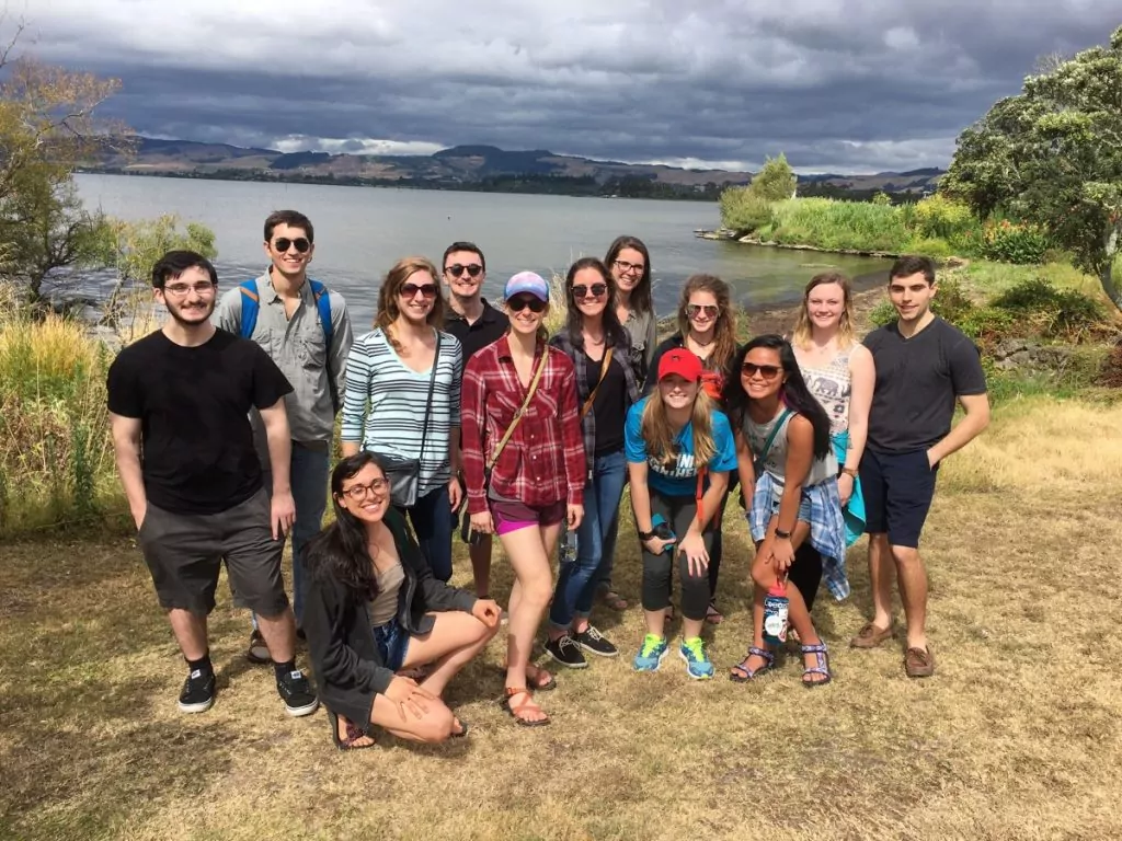 Study abroad students standing at beach on Somes Island, New Zealand