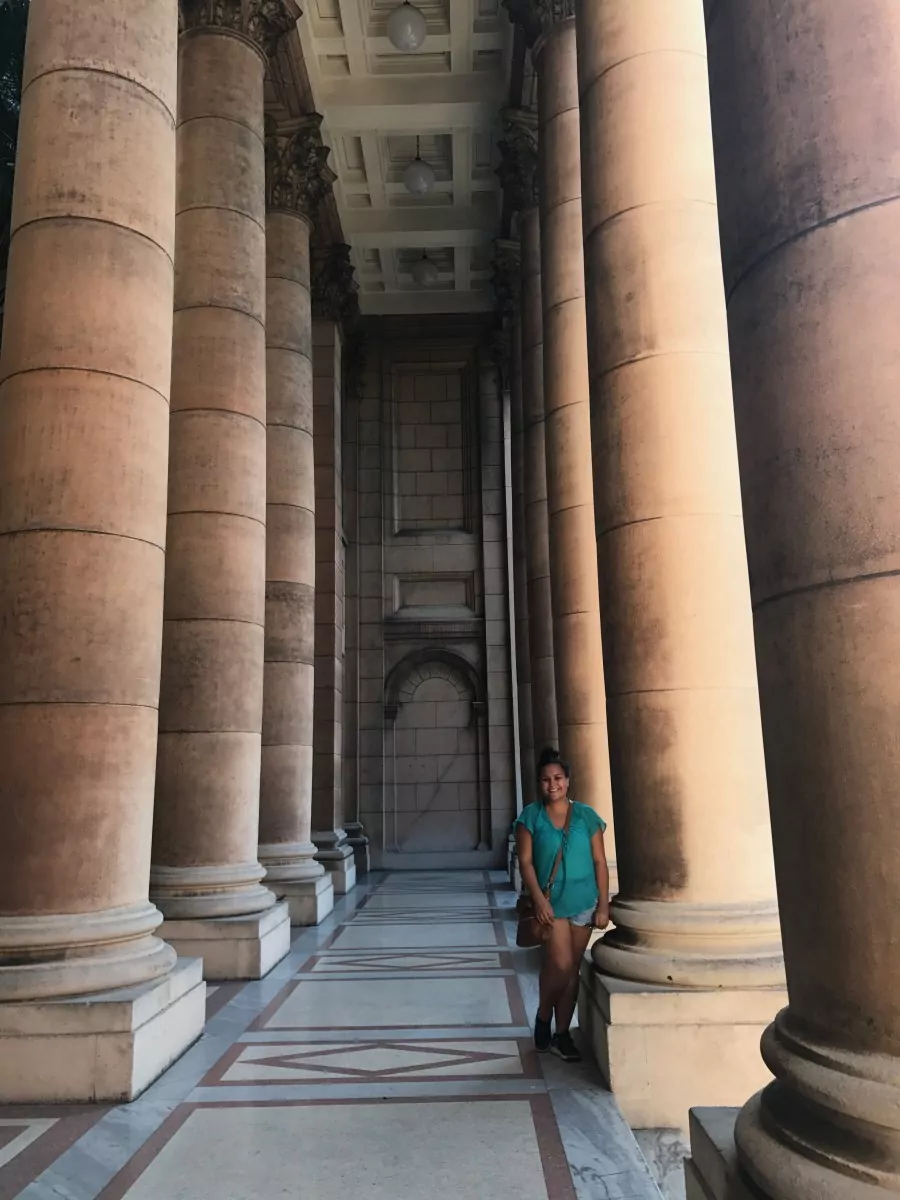 Anna Foster stands next to pillar in Havana Cuba