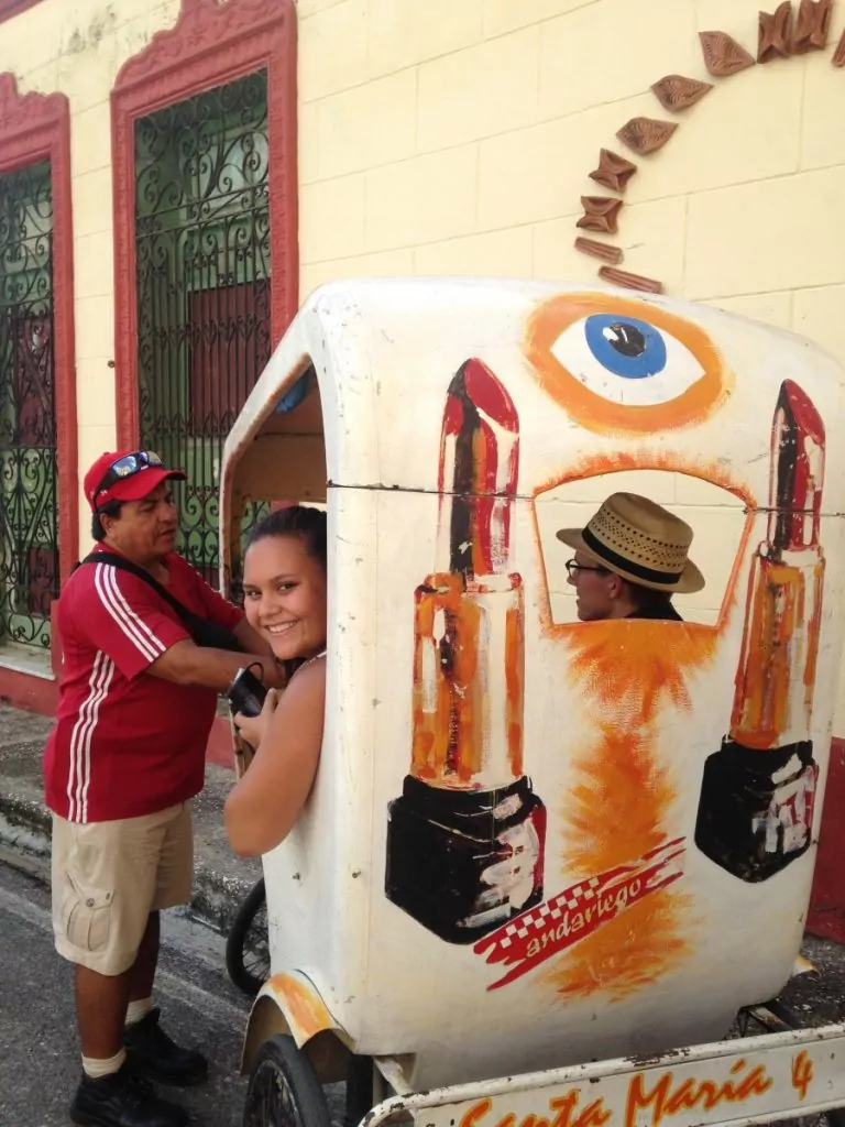 Anna Foster sits in unique taxi in Havana Cuba