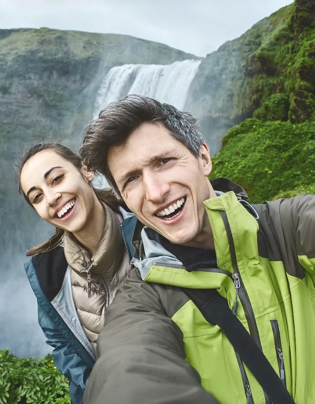 2 students in front of a waterfall in Iceland